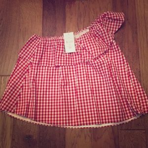 Ruffle top one shoulder shirt.